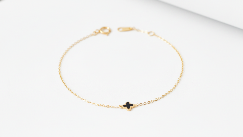14k yellow gold bracelet featuring a clover design