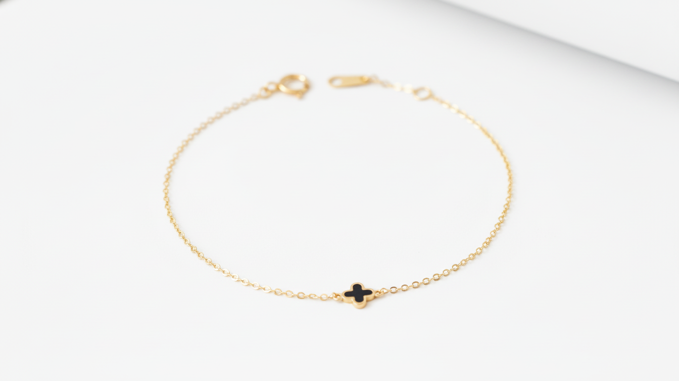 14k yellow gold bracelet featuring a clover design
